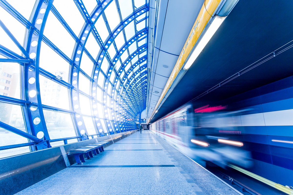 A blurry shot of a train arriving at a railway platform in Flint, Texas. Original public domain image from Wikimedia Commons